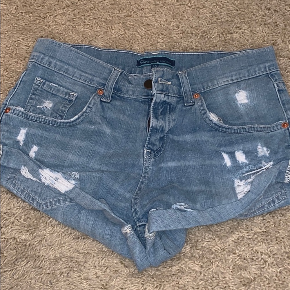 California made blue distressed rolled jean shorts